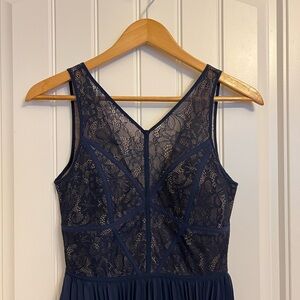 BCBG lace navy dress with a pleated bottom